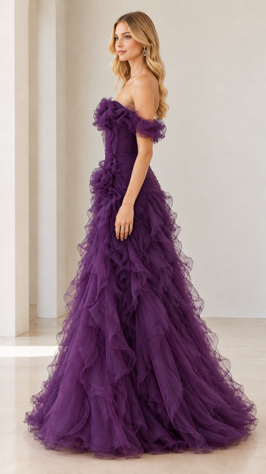 Side angle view of woman modeling deep purple tiered ruffle formal gown