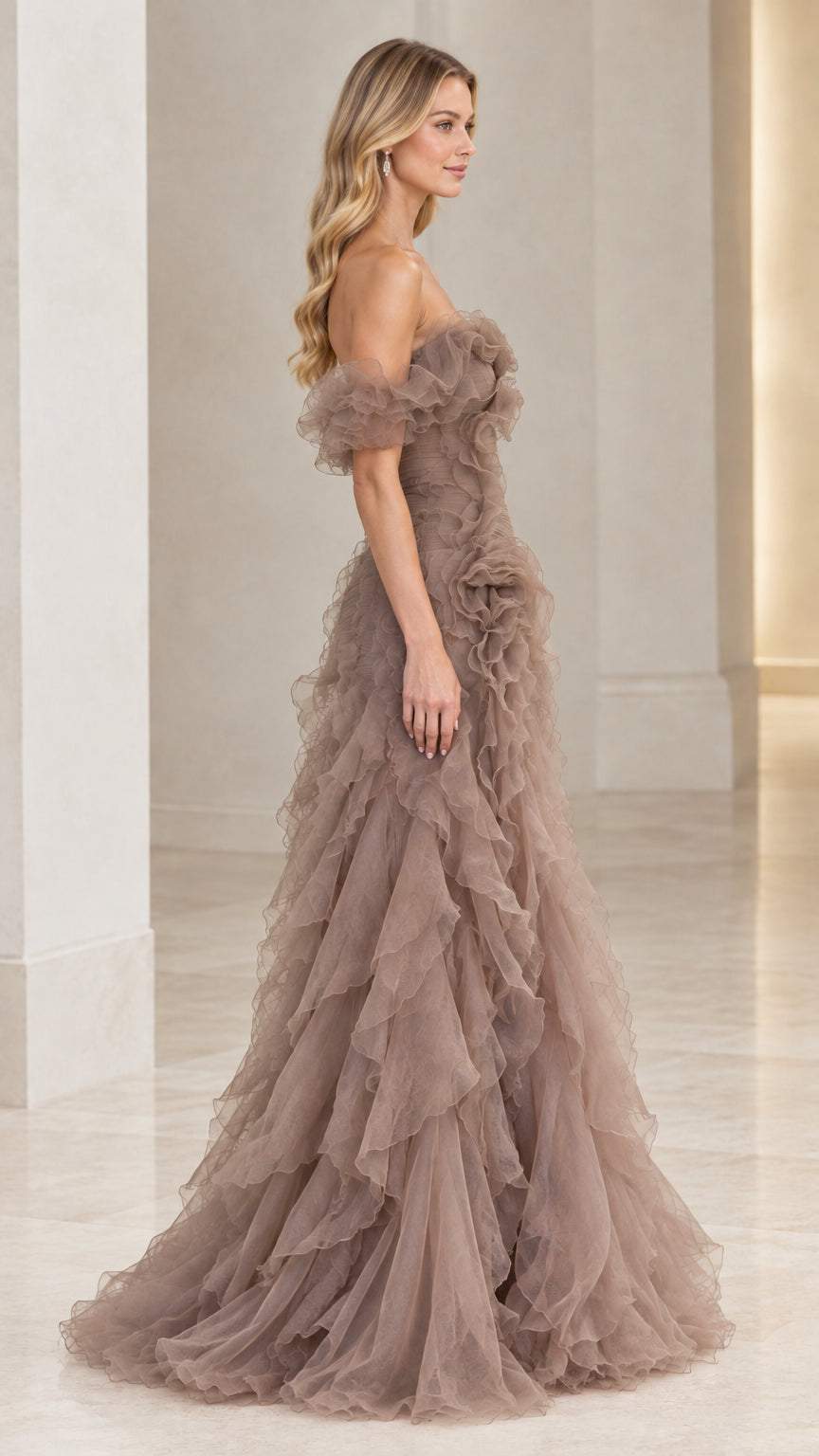 Side angle view of model in taupe tulle tiered ruffle ball gown