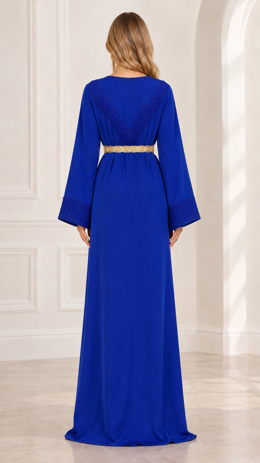 Back view of royal blue kaftan gown showing upper back beaded detail
