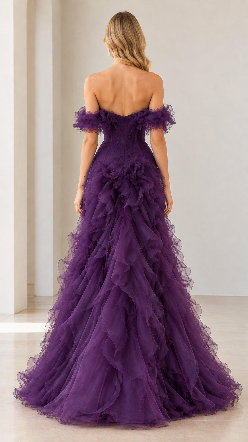 Back view of deep purple off-the-shoulder ruffle gown showing plunging back detail
