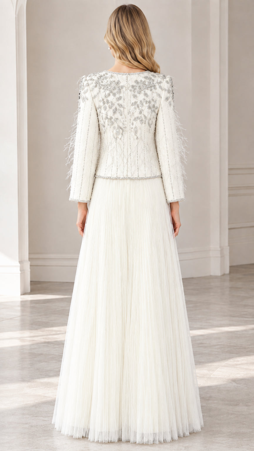 Back view of ivory beaded jacket and full-length pleated tulle skirt