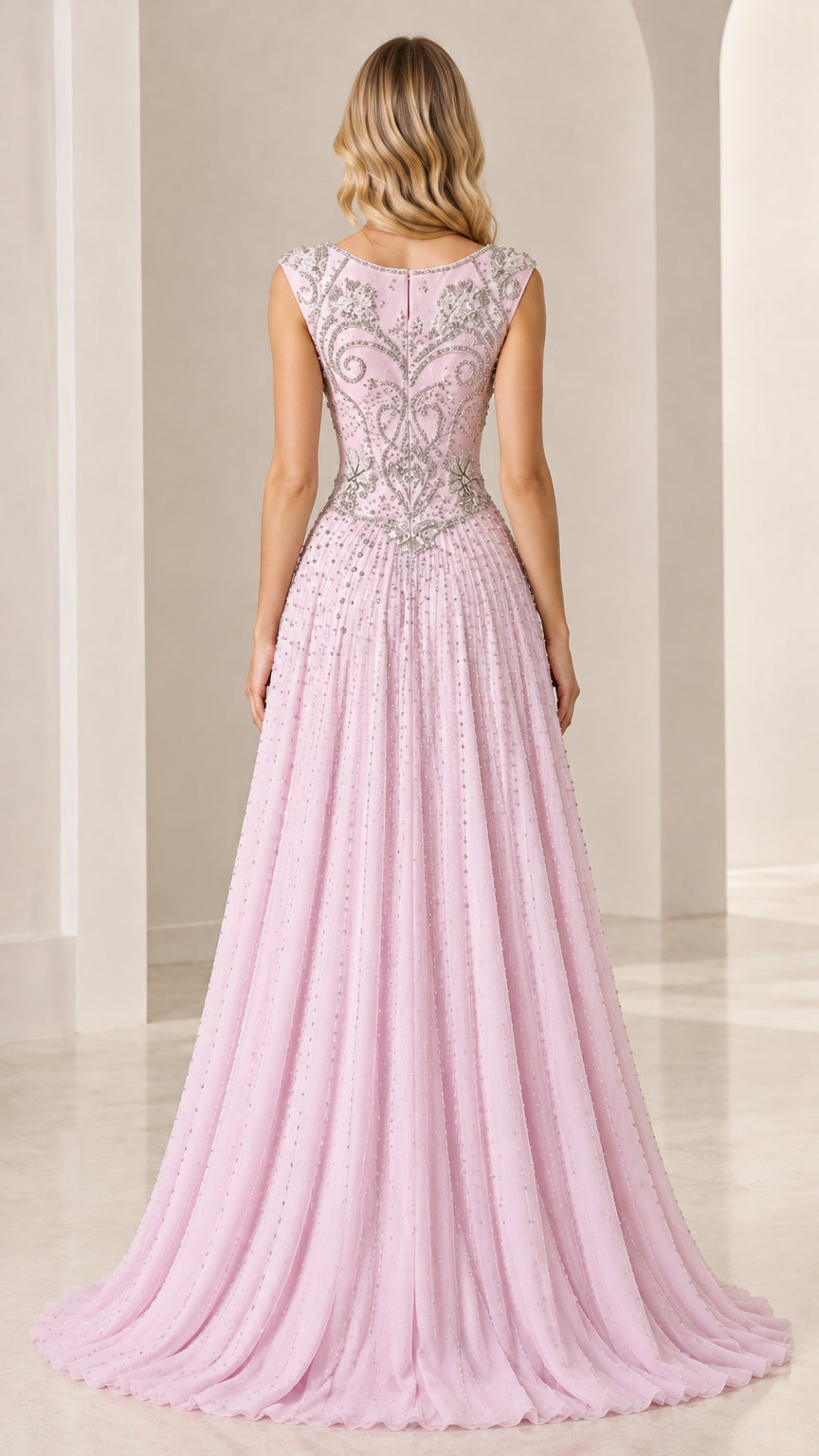 Back view of blush pink evening gown showing beaded detailing and zipper