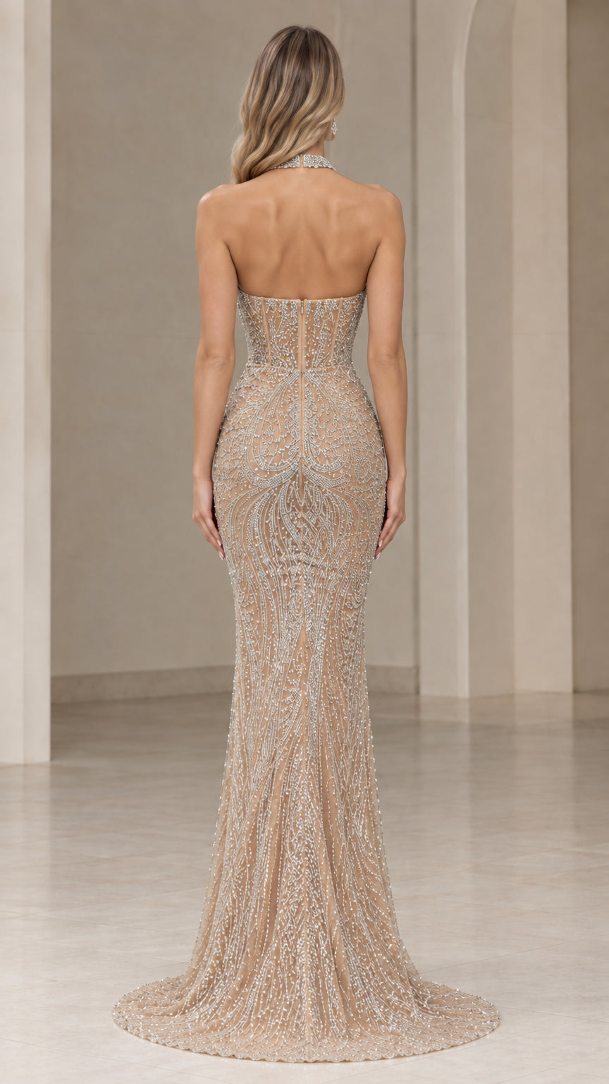 Back view of champagne open back beaded mermaid gown with floor-length train