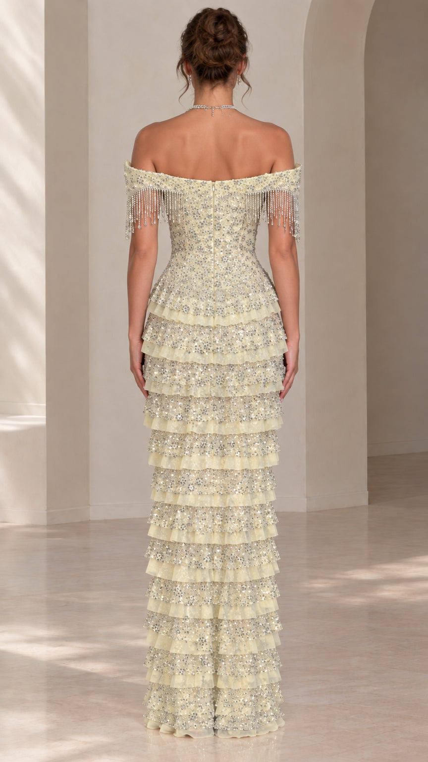 Back view of light yellow off-shoulder tiered evening gown