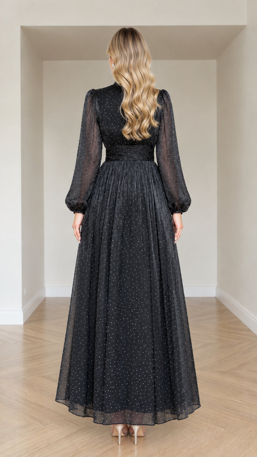 Back full-length view of woman in Black pleated high neck long evening gown