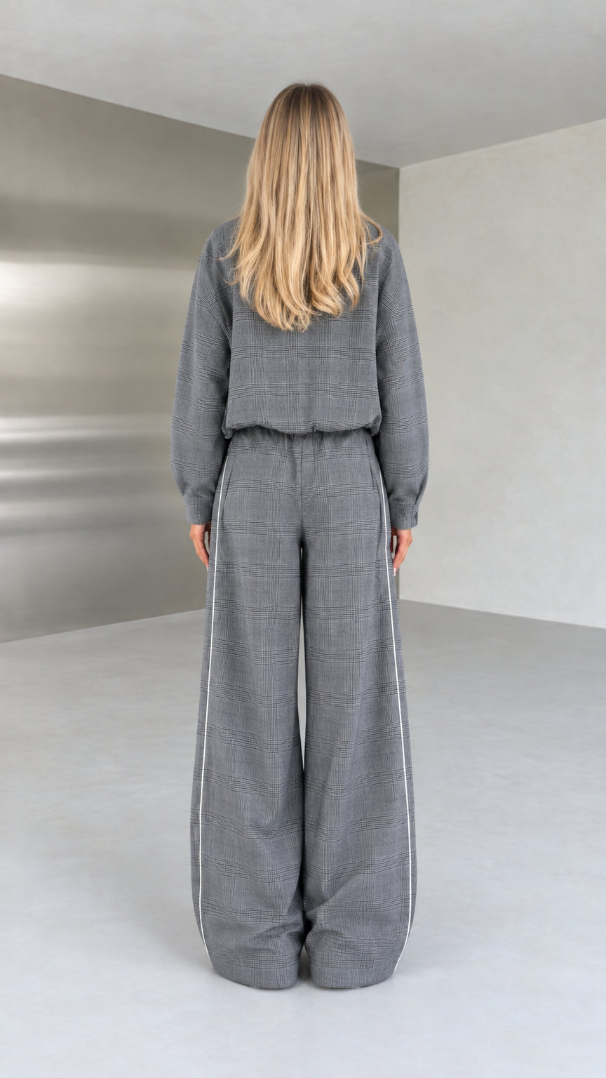 Back view of model in grey relaxed-fit two-piece loungewear set