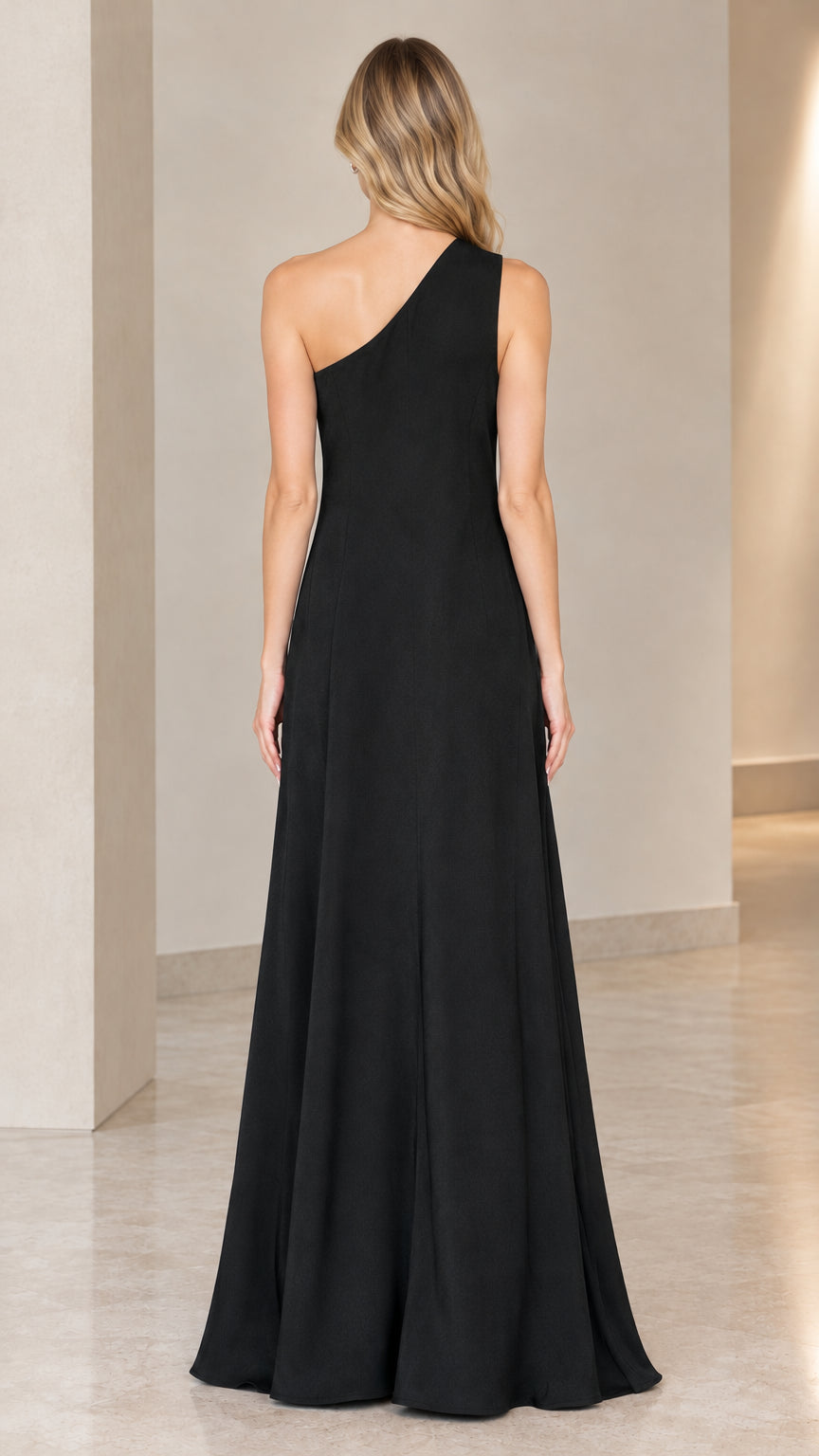 Back view of model showing black one-shoulder maxi dress