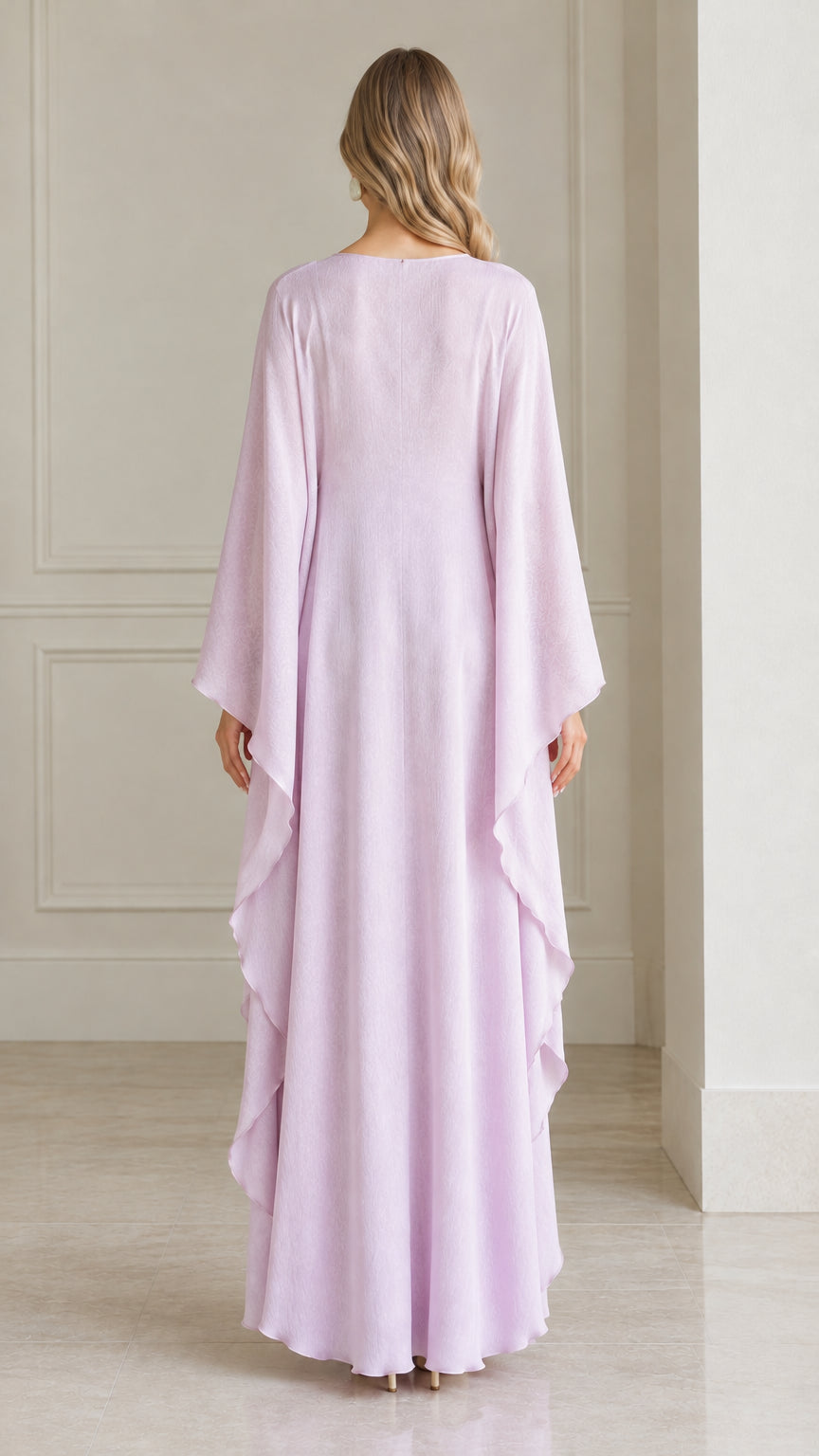 Back view of woman showing draped back and sleeves of lavender kaftan gown