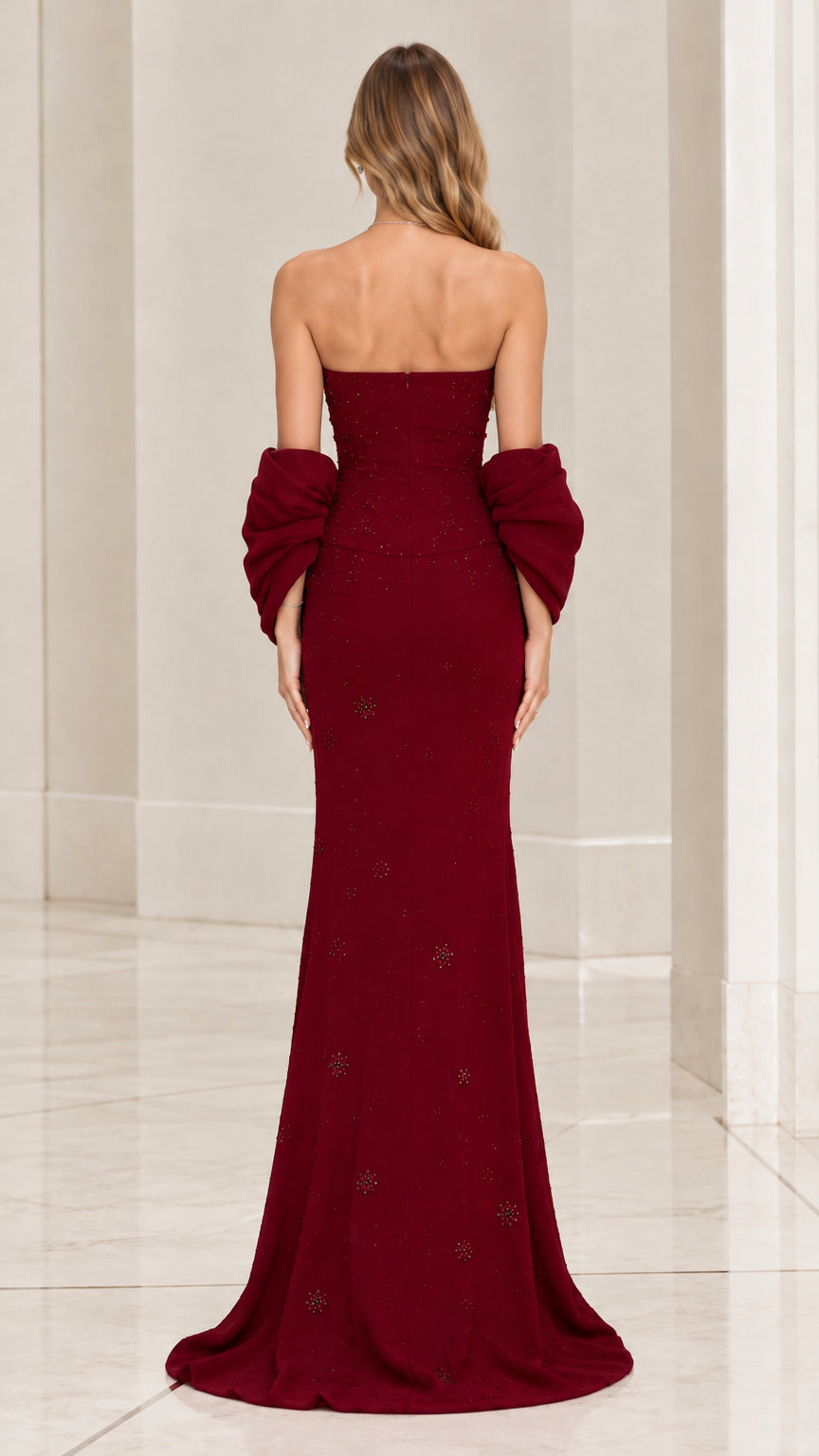 Back view of model in burgundy strapless evening dress with matching wrap