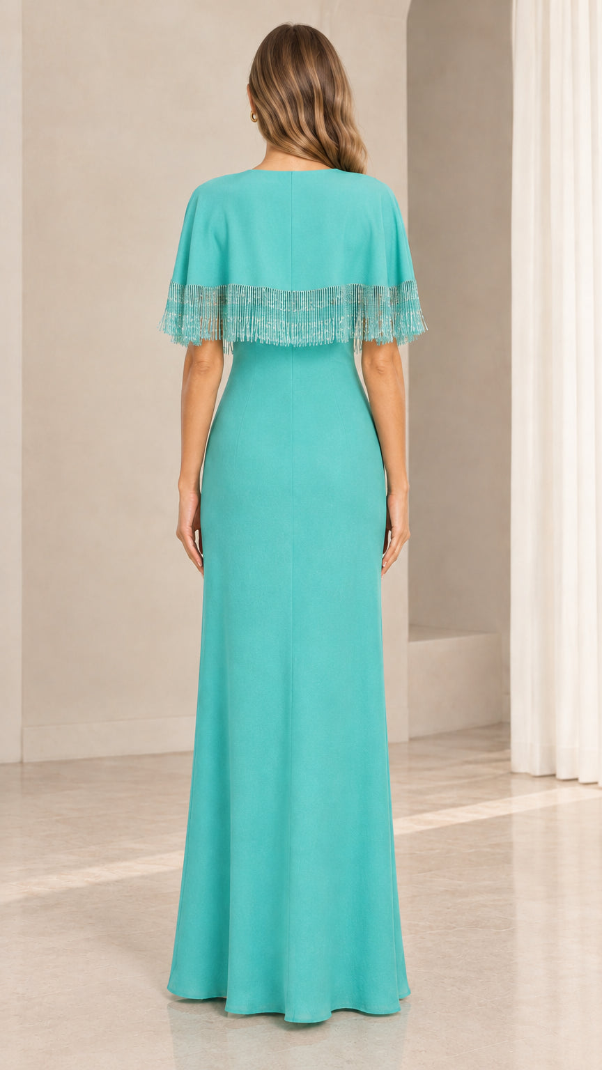 Back view of turquoise evening maxi dress showing smooth draped capelet