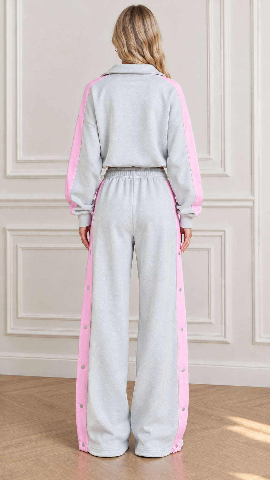Back view of Heather Grey two-piece lounge tracksuit set with pink contrast panels