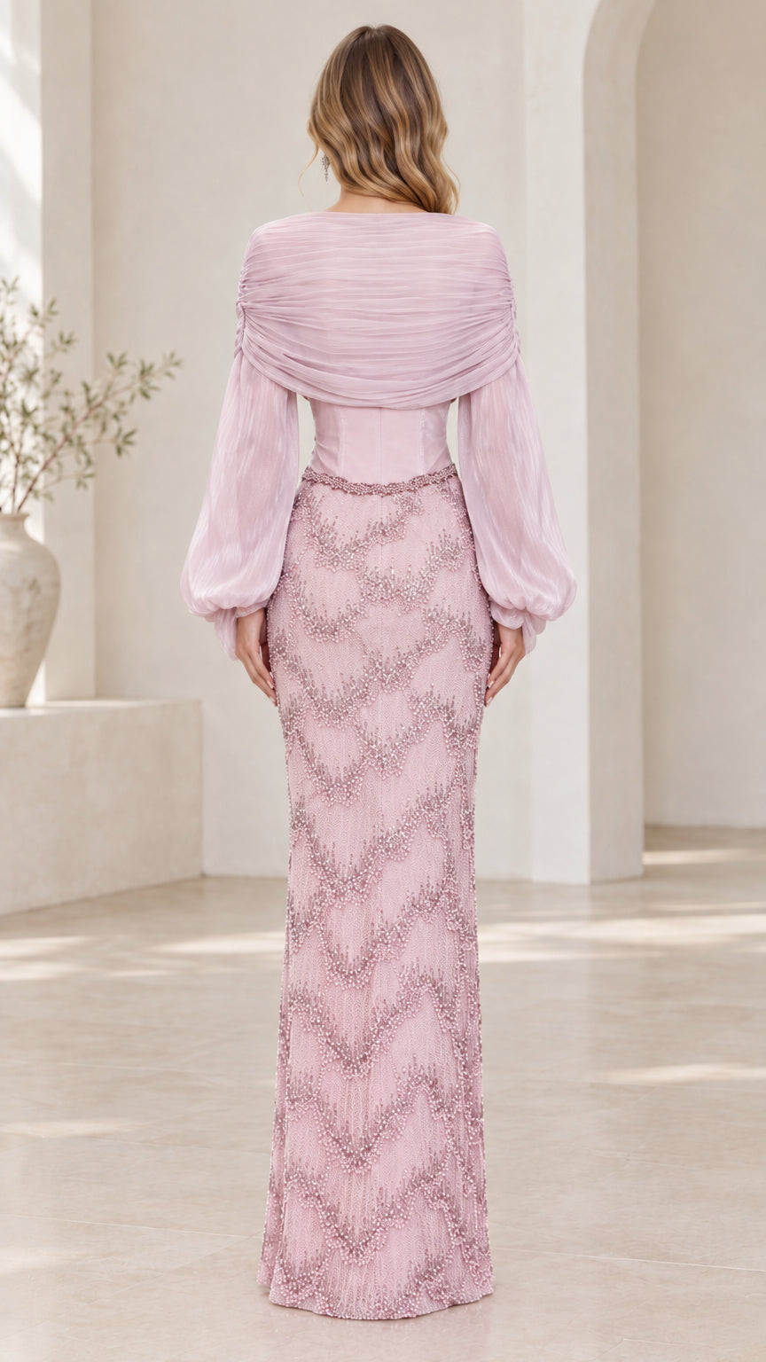 Back view of dusty pink draped bodice long sleeve formal gown