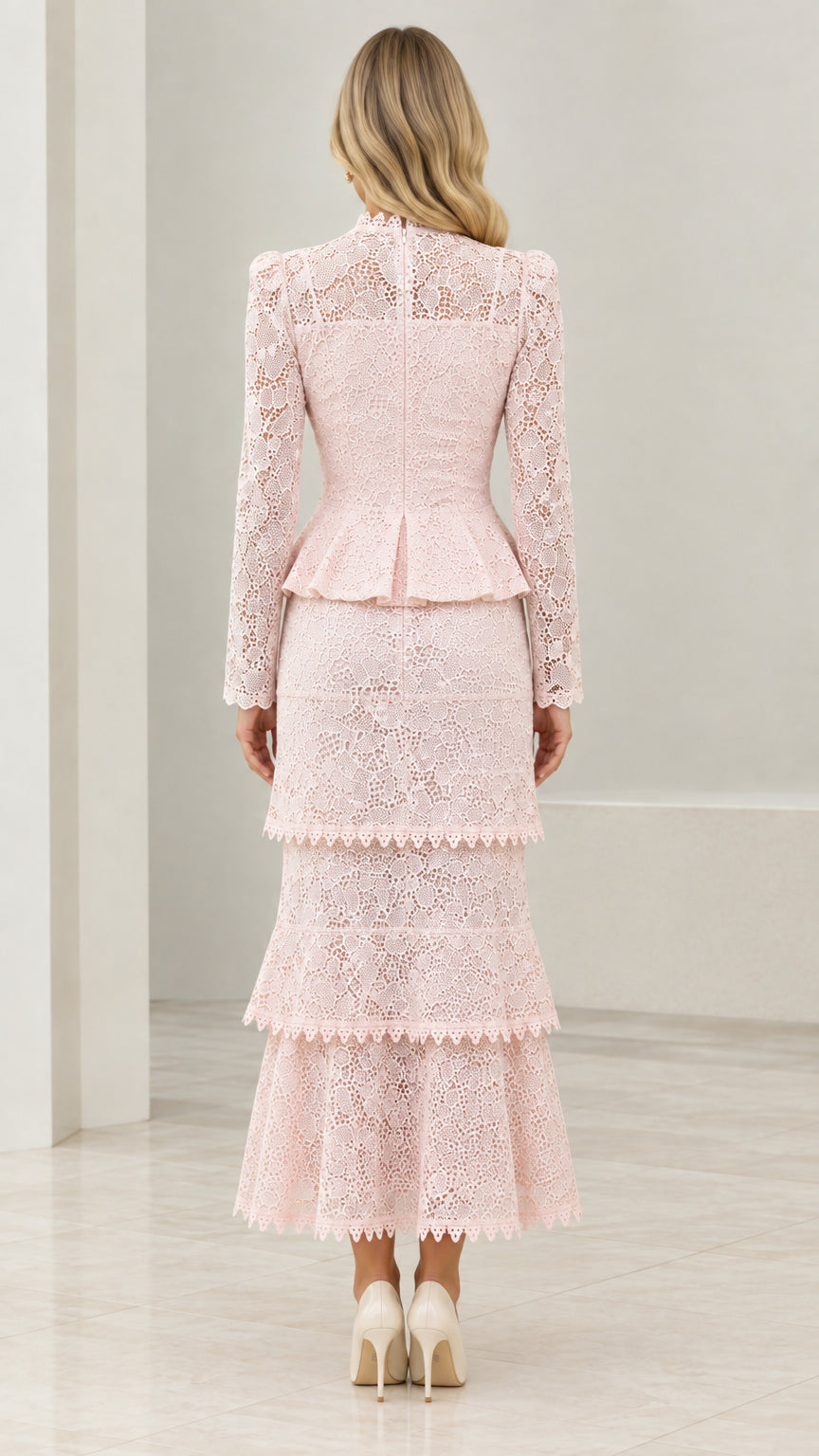 Back view of model wearing Blush Pink tiered lace evening set