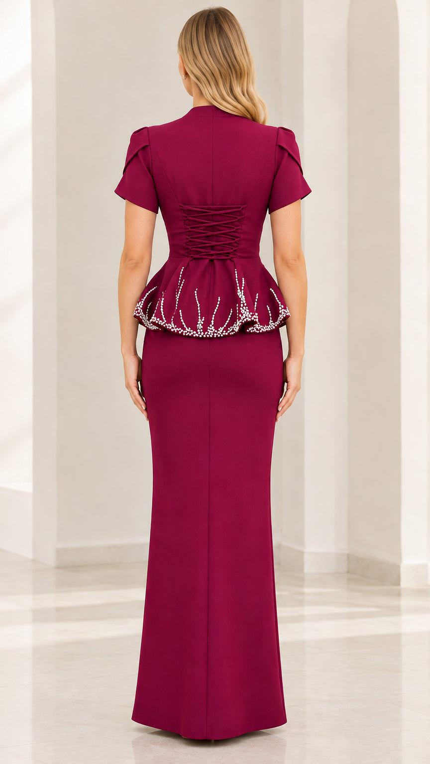 Back view of Burgundy evening gown showcasing lace-up corset back and peplum detail