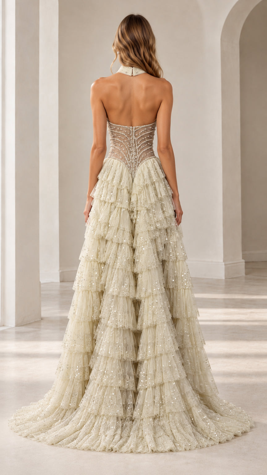 Back view of model in open-back Champagne tiered ruffle evening gown