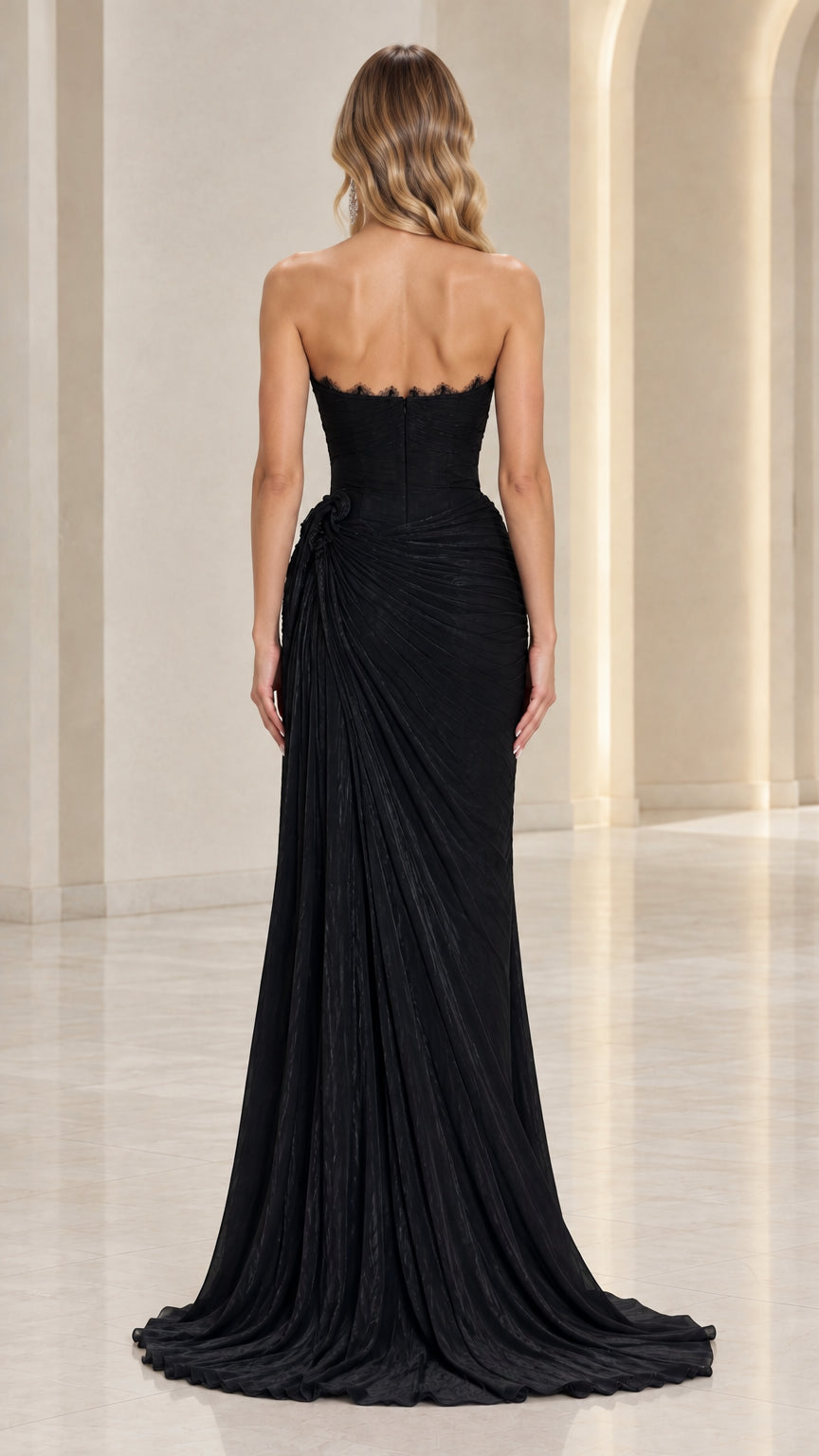 Back view of black strapless evening gown showing floor-length sweeping train