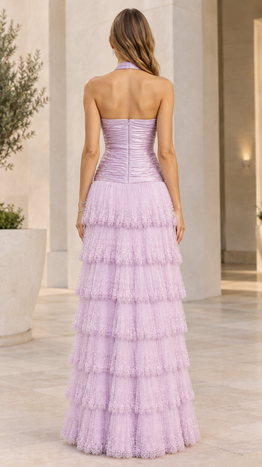 Back view of model in lilac halter open back evening gown