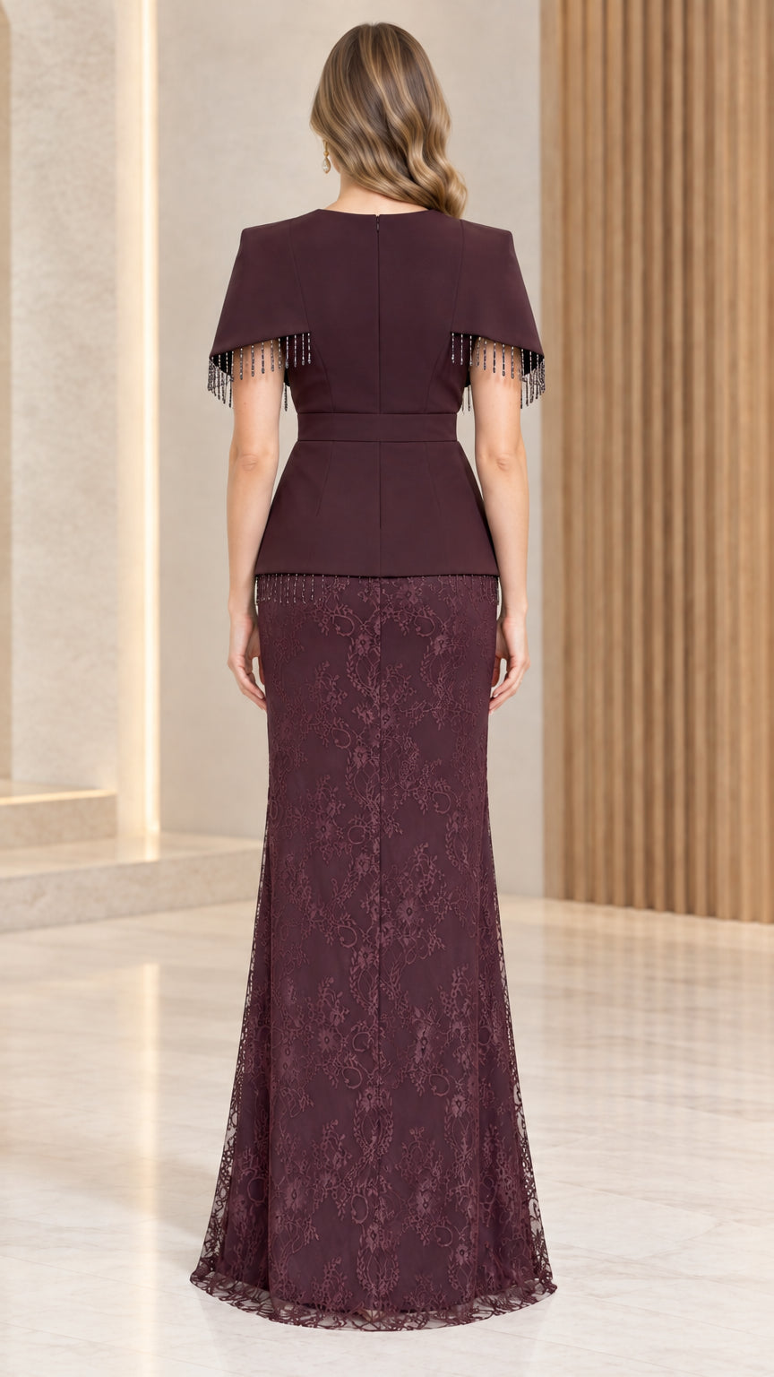Back view of burgundy lace evening gown showing zipper and capelet overlay