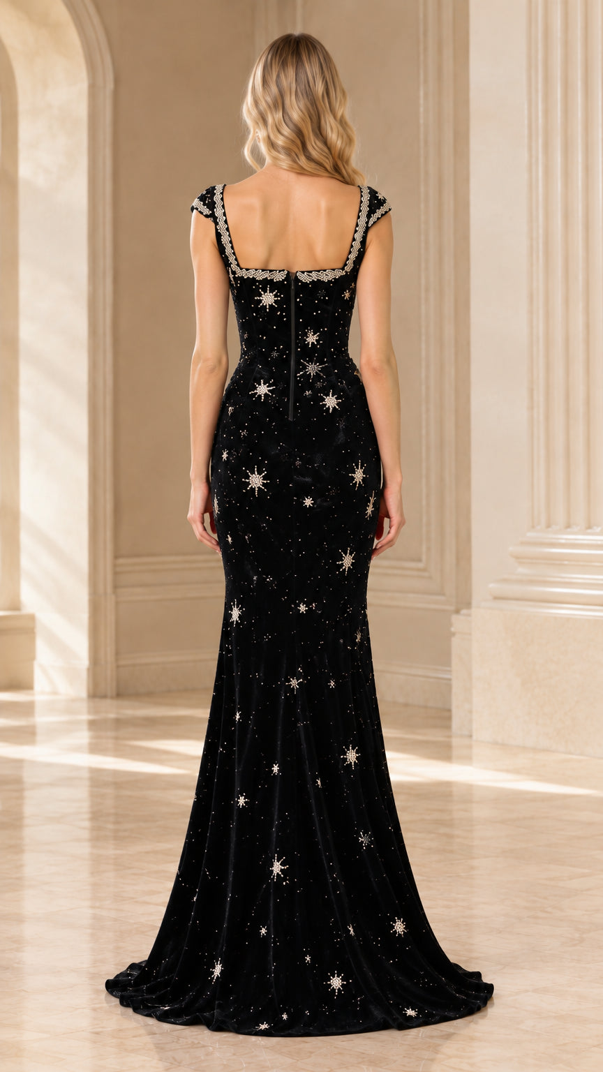 Back view of black velvet evening gown featuring square back and subtle train