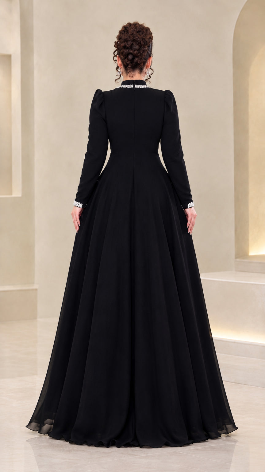 Back view of model wearing floor-length black chiffon evening dress