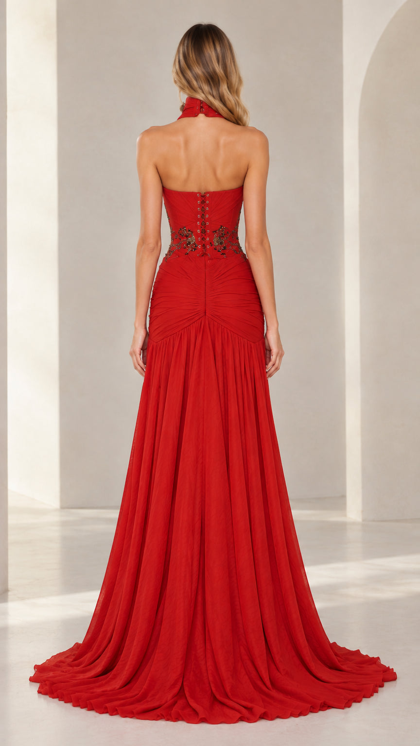 Back view of red evening gown showing lace-up corset and open back detail