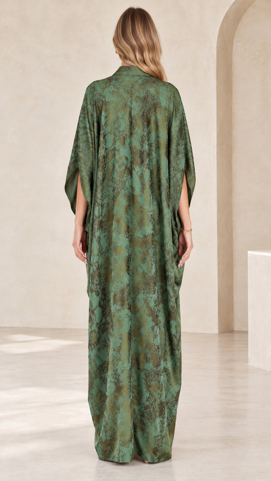 Back view of flowing green printed kaftan maxi dress