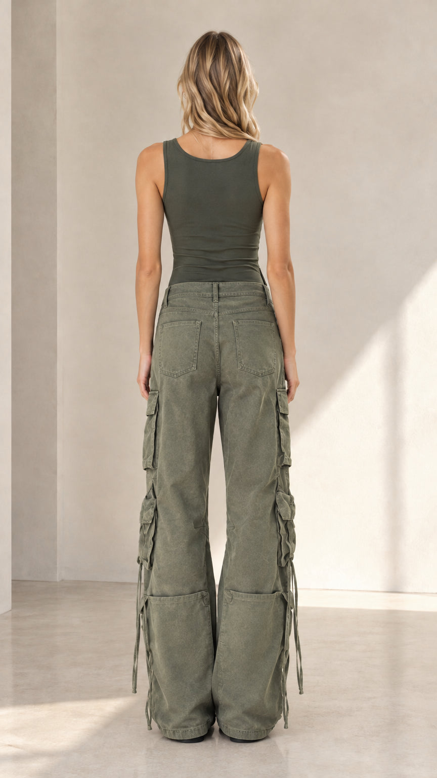 Back view of woman wearing relaxed army green wide leg cargo pants
