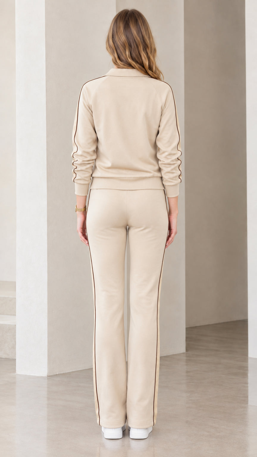 Back view of beige track jacket and straight-leg pants set