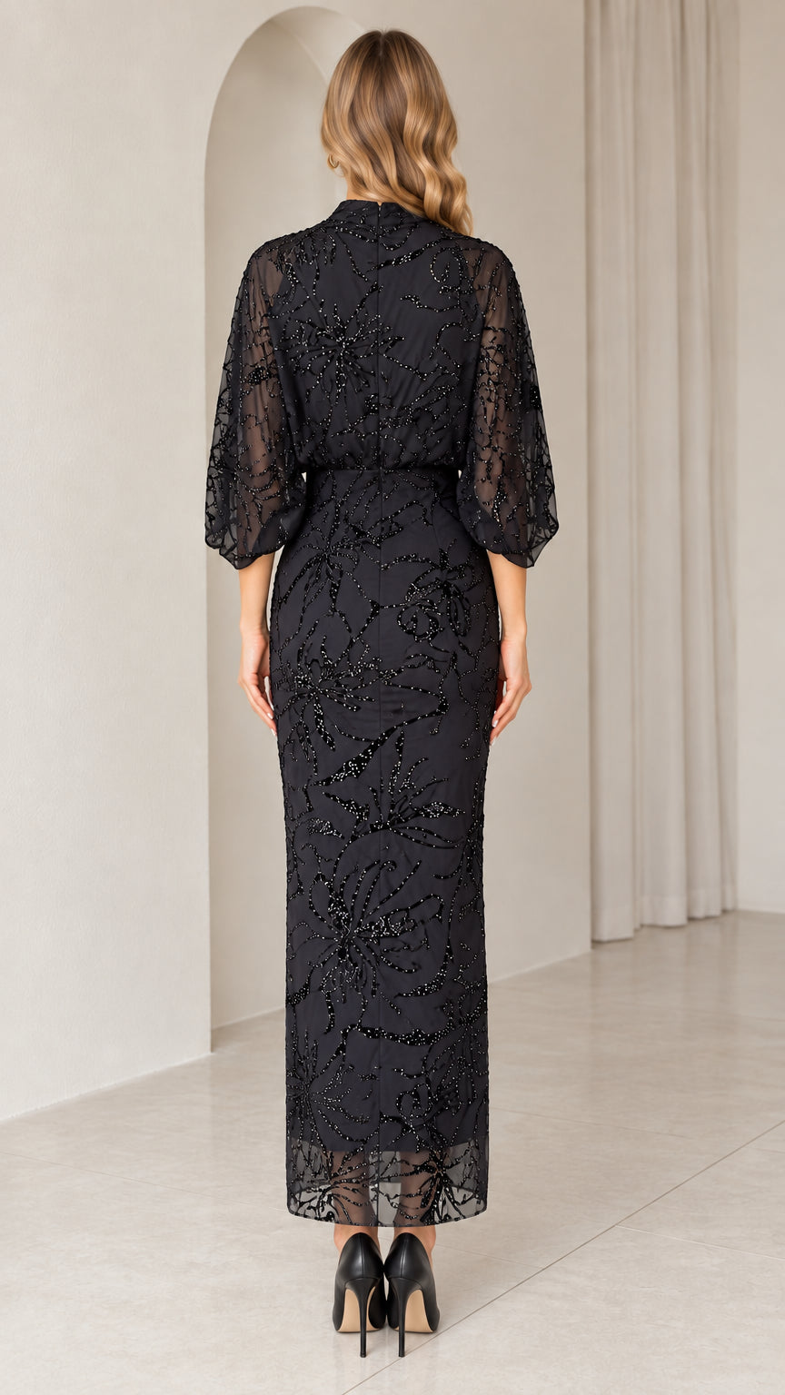 Back view of black high neck embellished evening gown