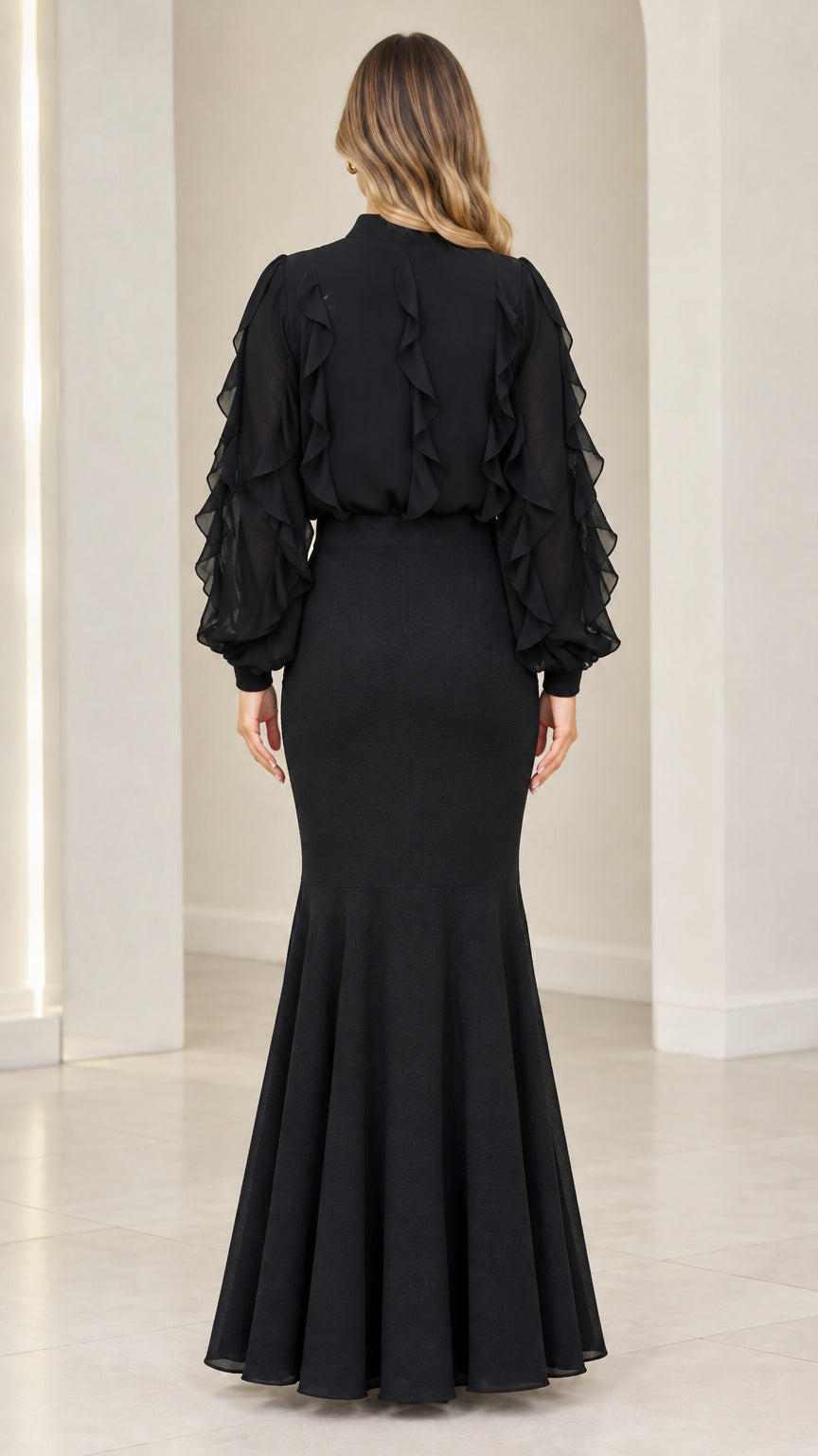 Back view of black mock neck evening maxi dress with mermaid flare