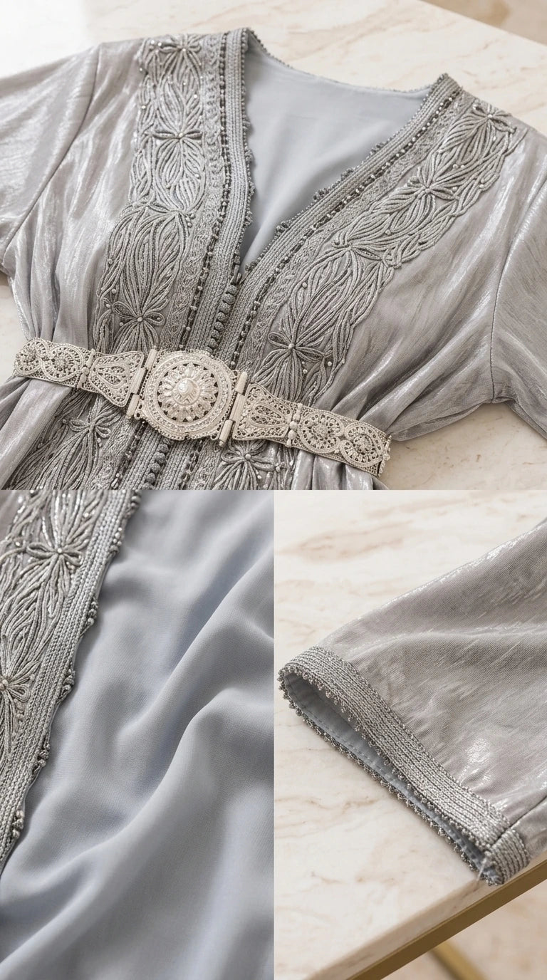 Close-up detail of silver caftan embroidery, textured fabric, and belt