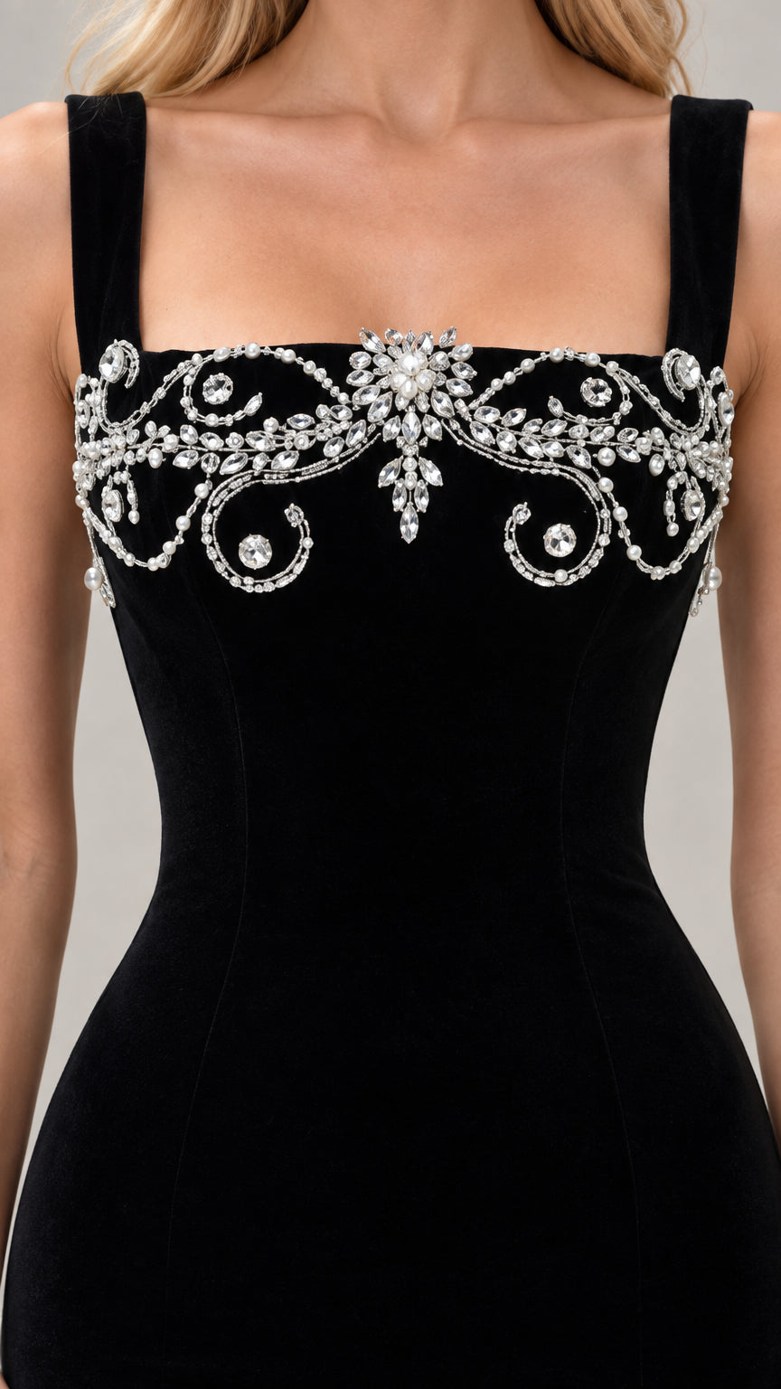 Close-up detail of ornate crystal and faux pearl embroidery on the square neckline bodice