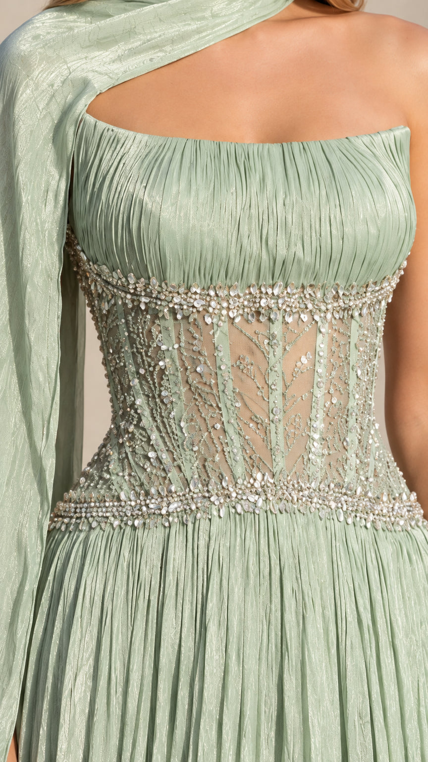 Close-up detail of beaded illusion corset bodice and pleated neckline on sage green gown