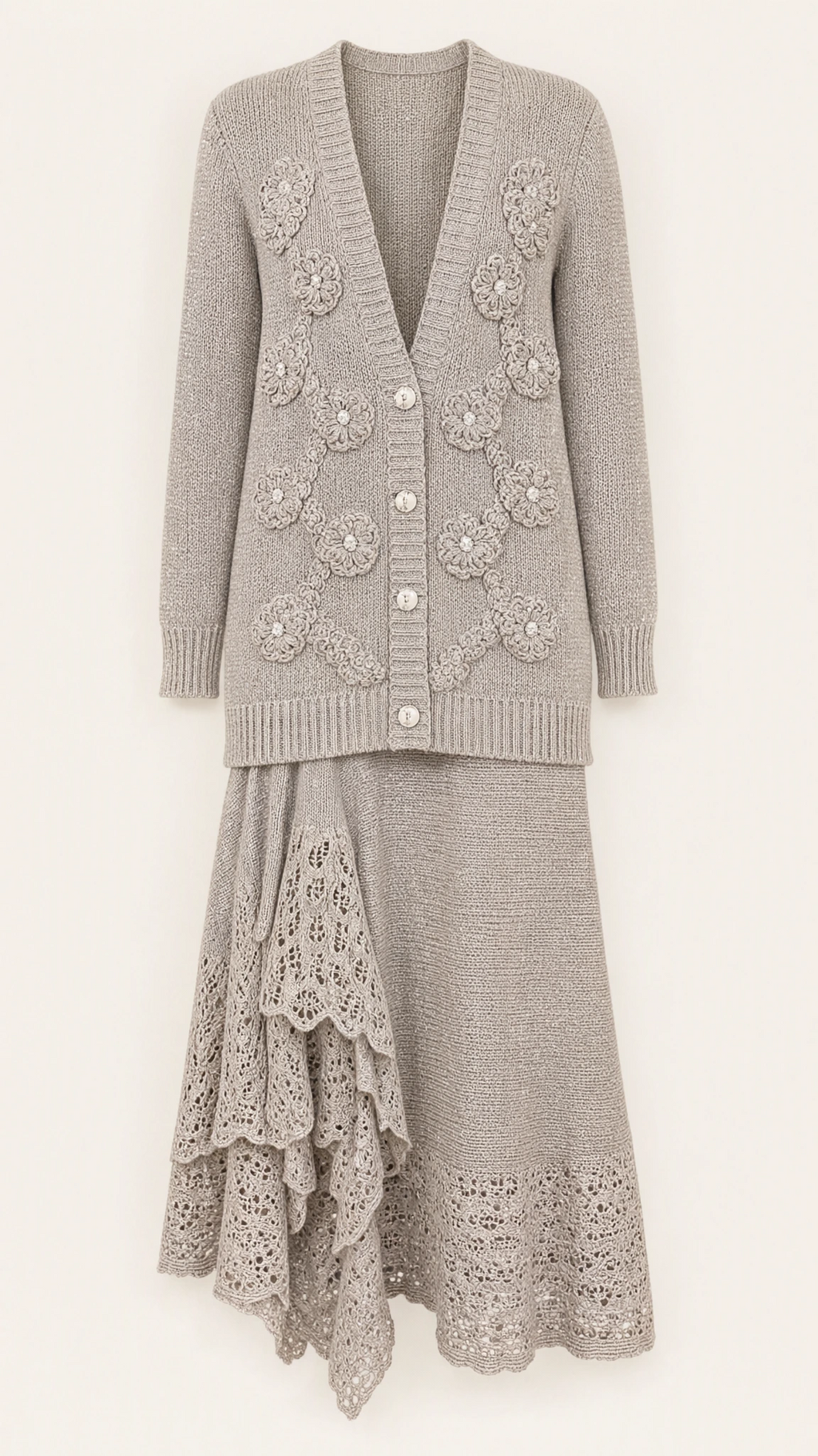 Studio product flat lay of silver grey floral applique knit cardigan and lace hem skirt set