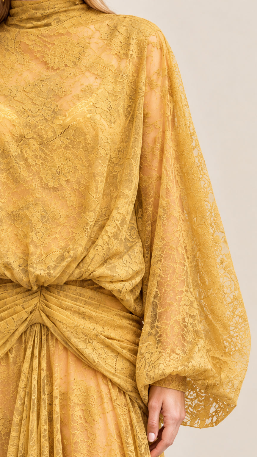 Close-up detail of Mustard Yellow floral lace fabric, high collar, and gathered waist draping