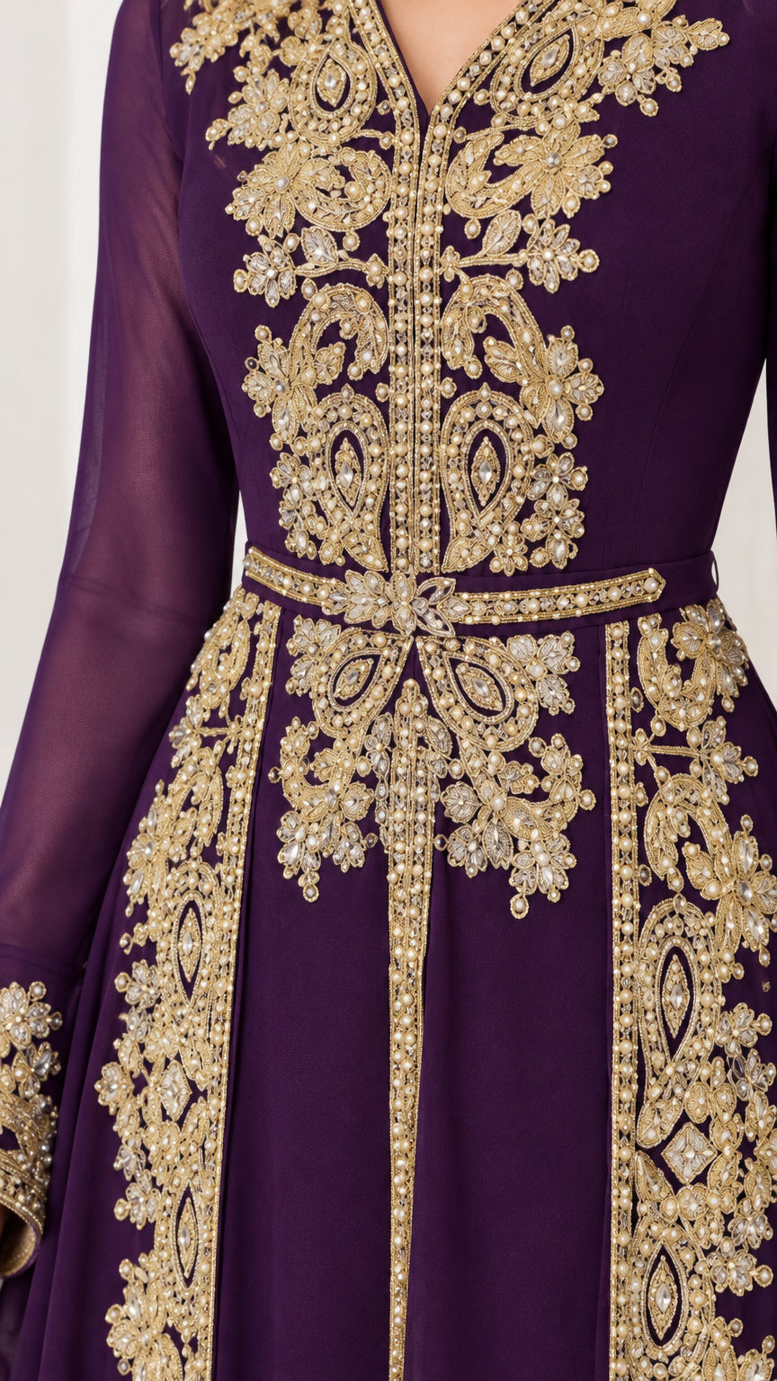 Close-up detail of metallic gold embroidery and beadwork on purple gown bodice