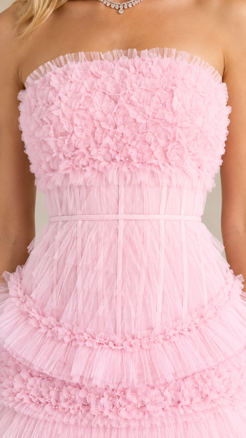 Close-up detail of textured micro-ruffle strapless bodice in pink tulle