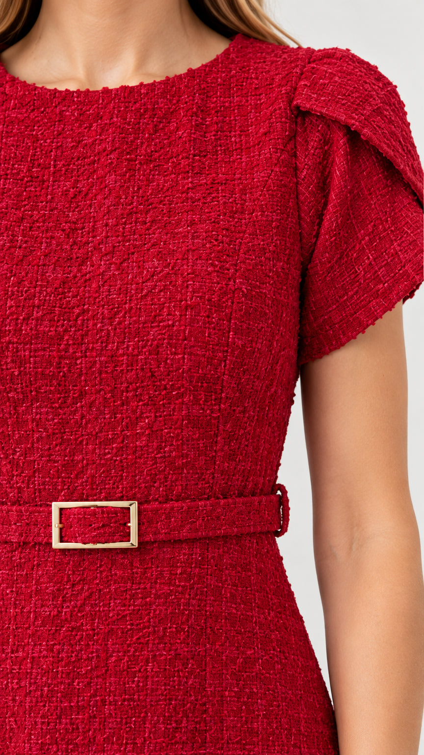 Close-up detail of red tweed fabric texture, round neckline, and petal sleeve construction