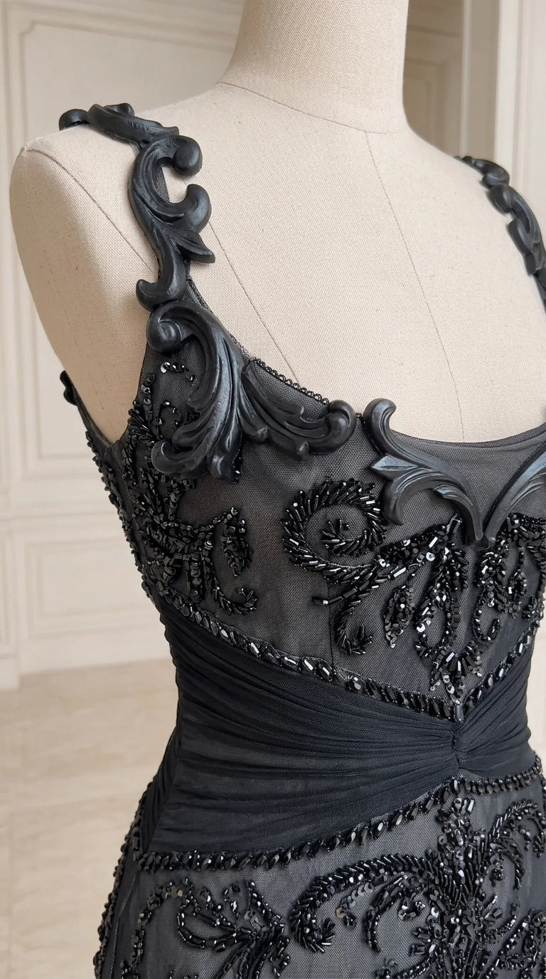 Close-up detail of ornate beadwork and sculpted strap embellishments on bodice