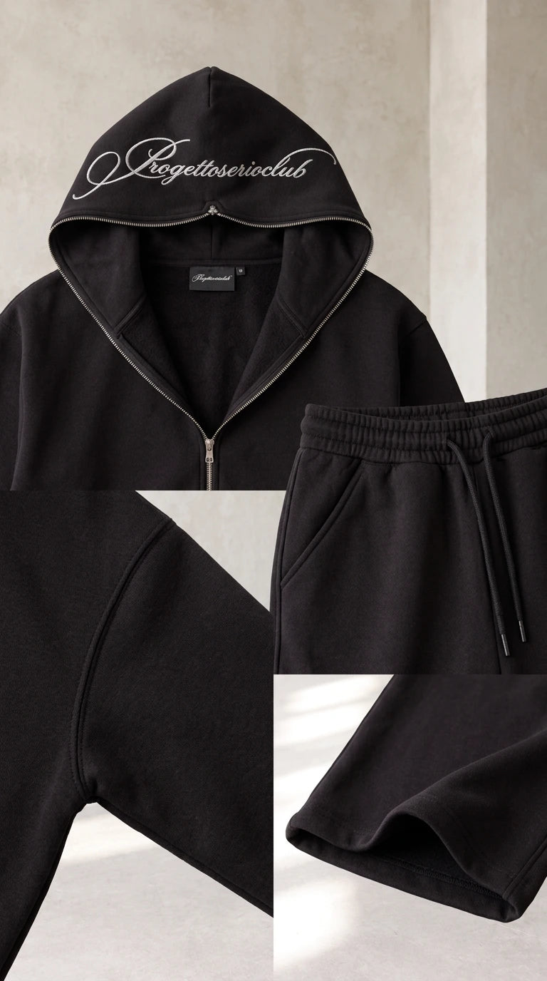 Close up details of black hoodie neckline, pocket stitching, drawstring waist, and hem