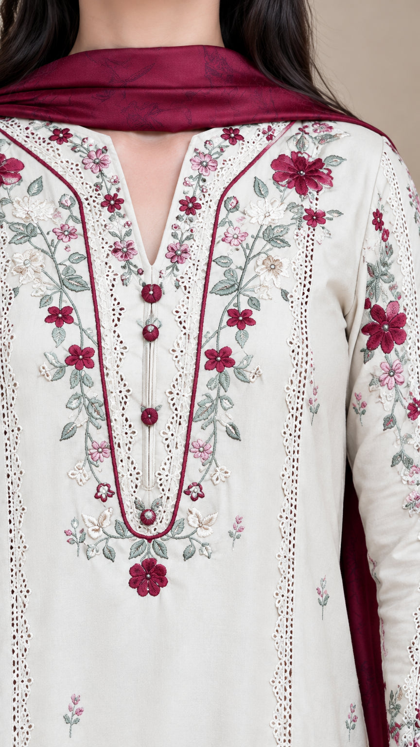 Close-up detail of split V-neckline featuring delicate floral embroidery and button accents