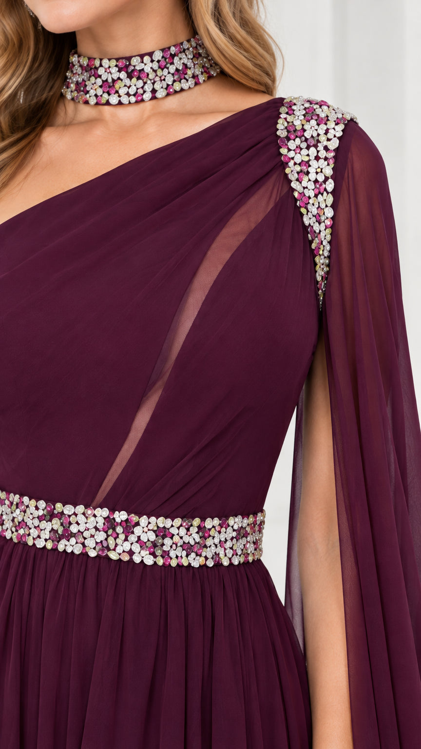 Close-up detail of beaded collar, sheer illusion cutout, and crystal waistband