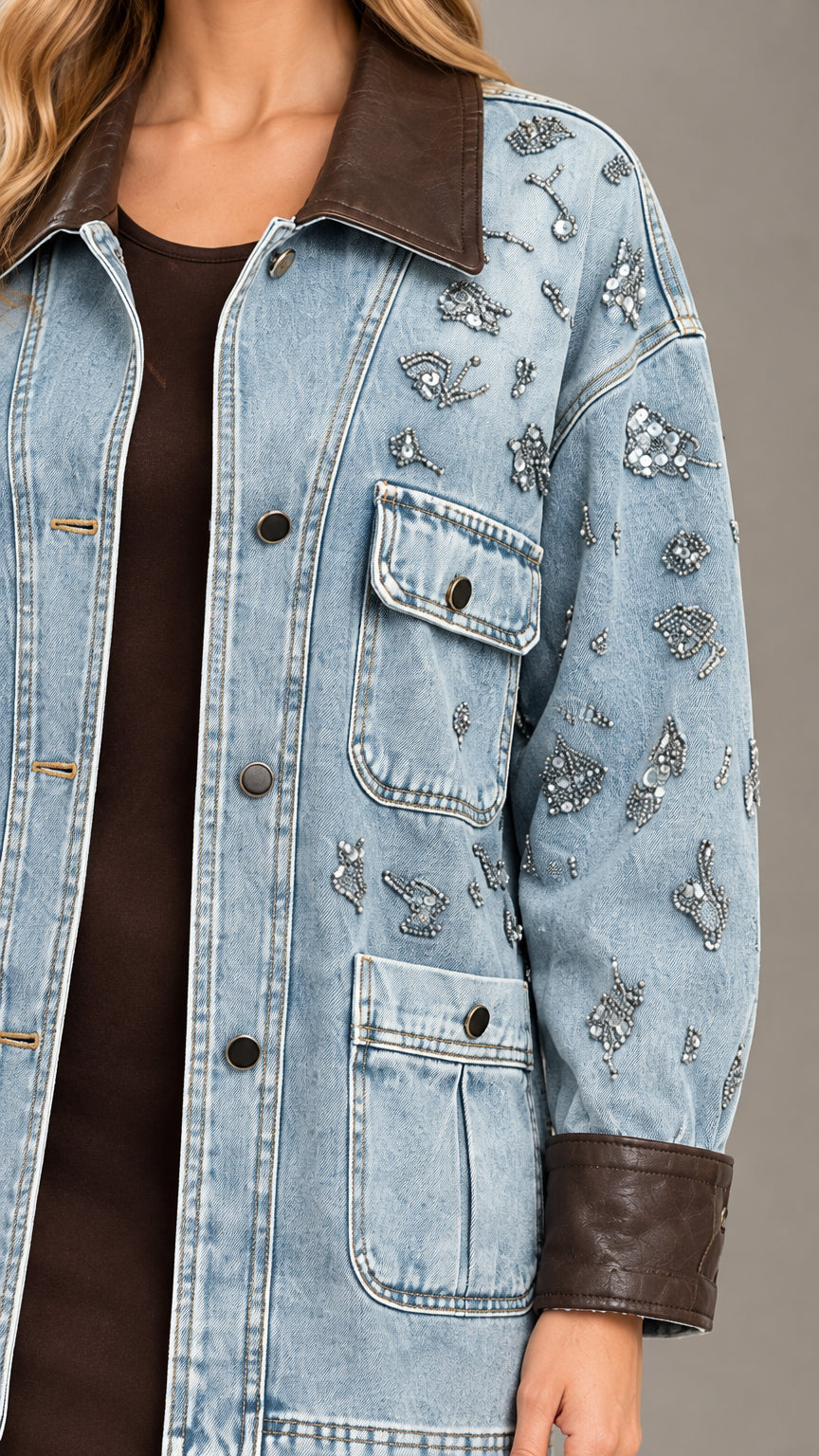 Close-up detail of crystal-look beading, button front, and leather-look collar on Light Blue denim jacket