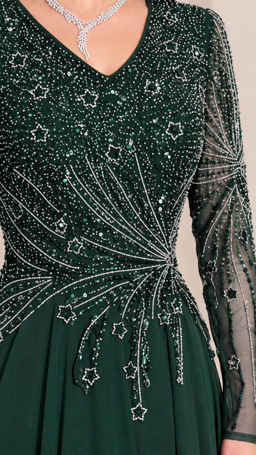 Close-up detail of dark green bodice featuring intricate starburst beadwork and sequins