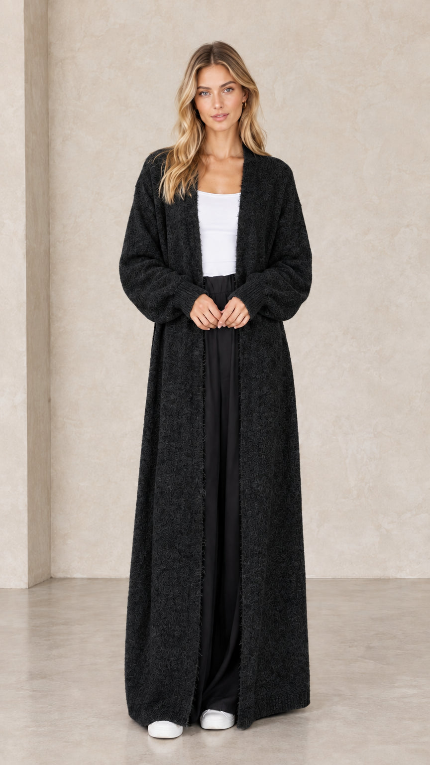 Full-length view of black maxi open-front duster cardigan