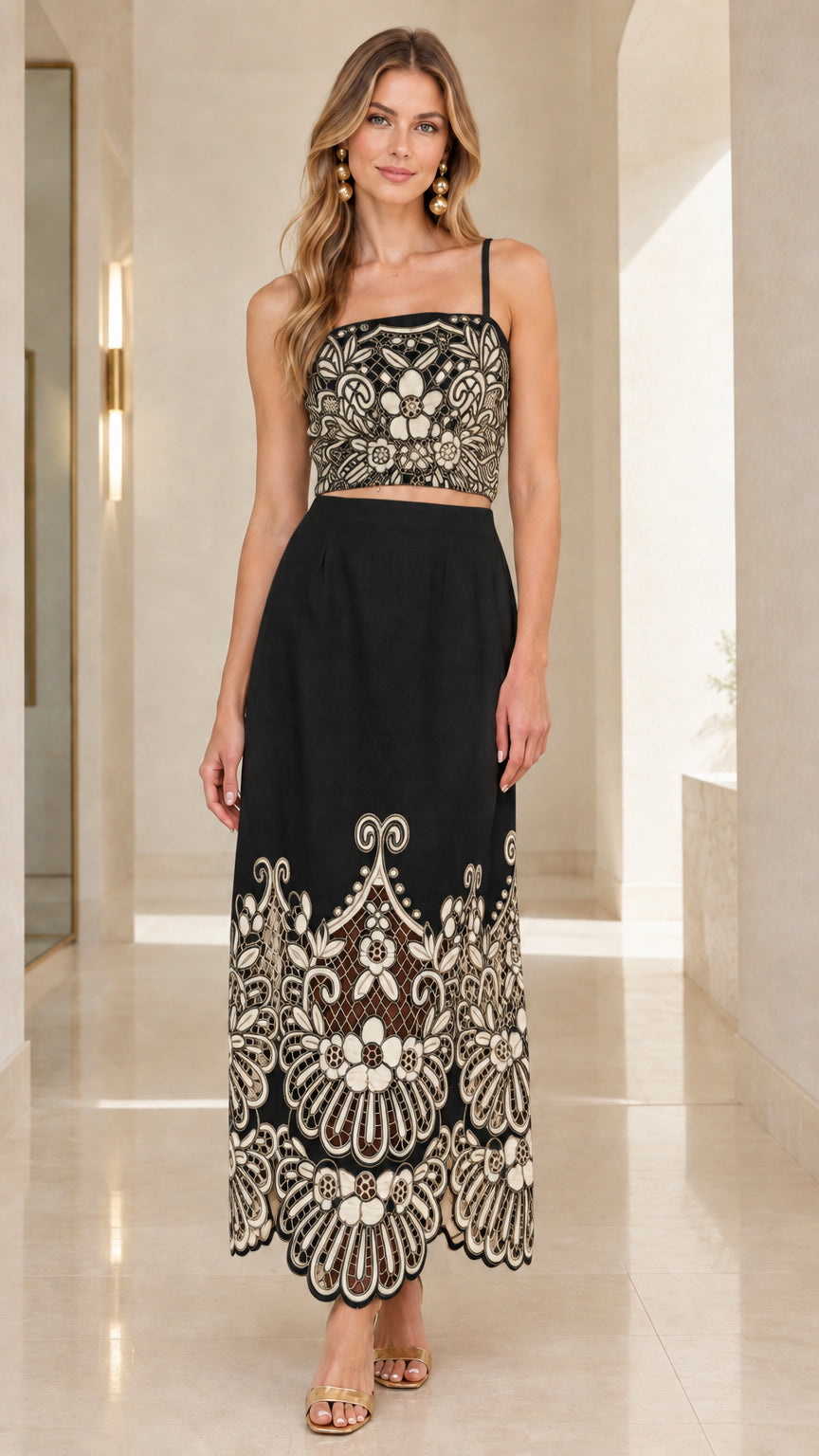 Black two-piece crop top and maxi skirt set with contrast embroidery