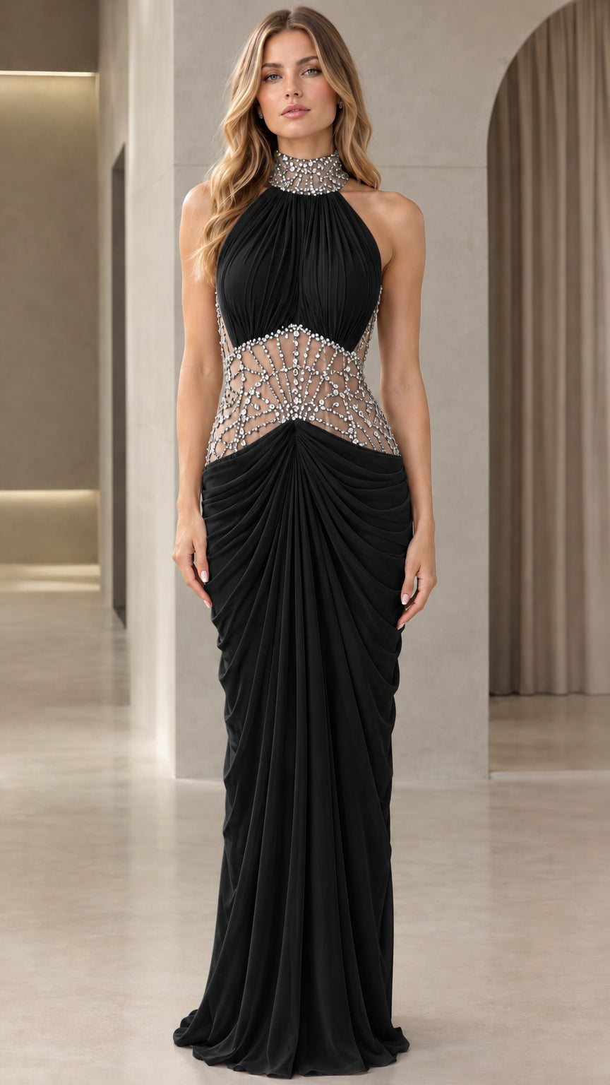 Front view of model wearing Black rhinestone embellished halter maxi evening gown