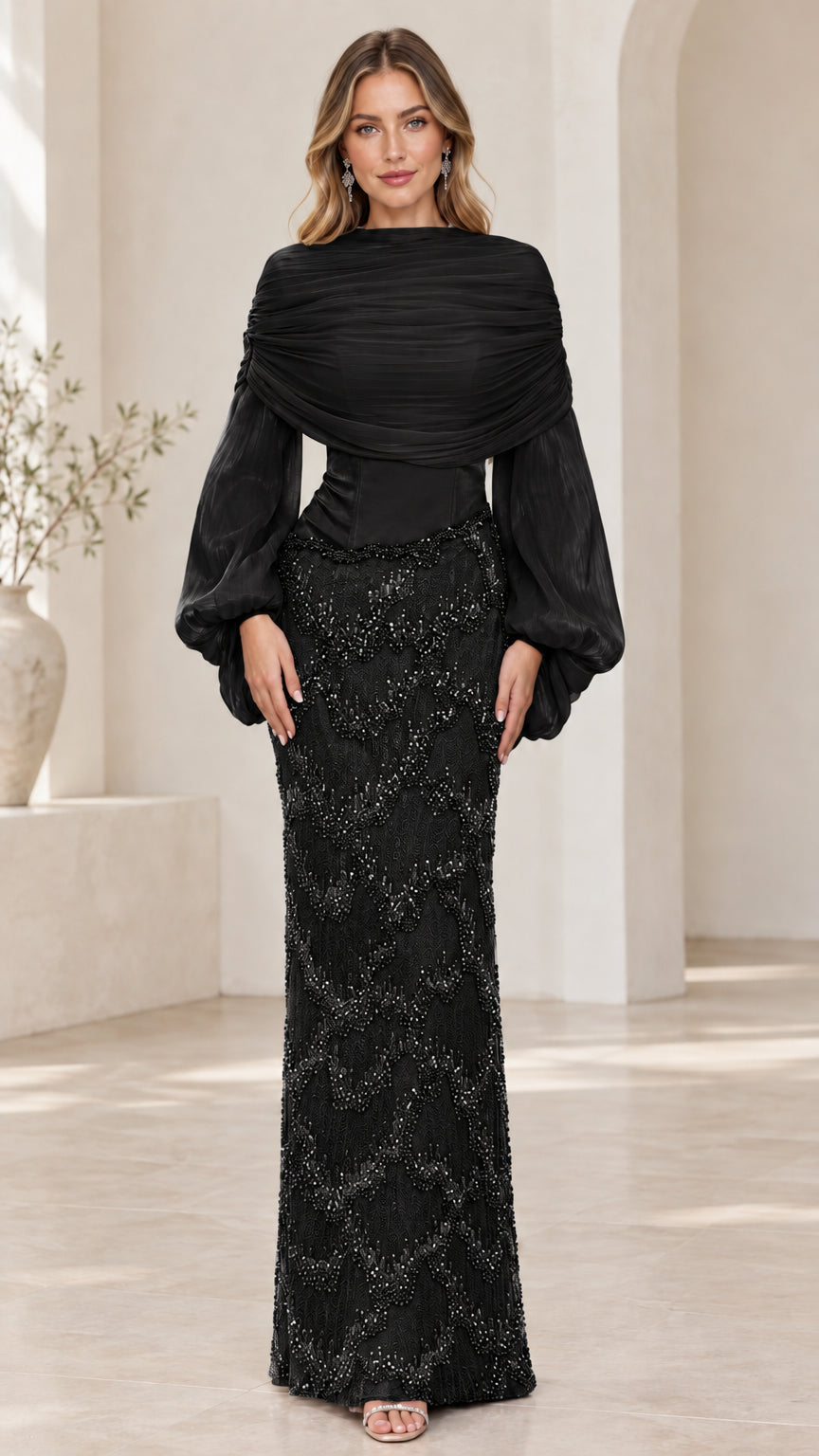Front view of model wearing black draped high neck beaded evening gown