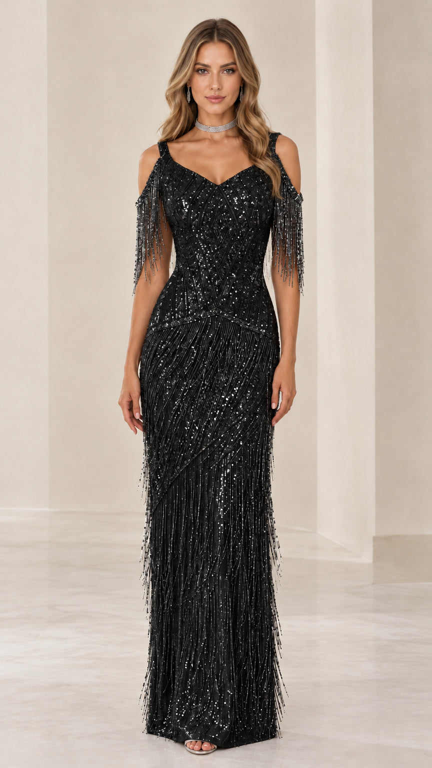 Front view of woman wearing Black sequin cold-shoulder fringe maxi evening gown