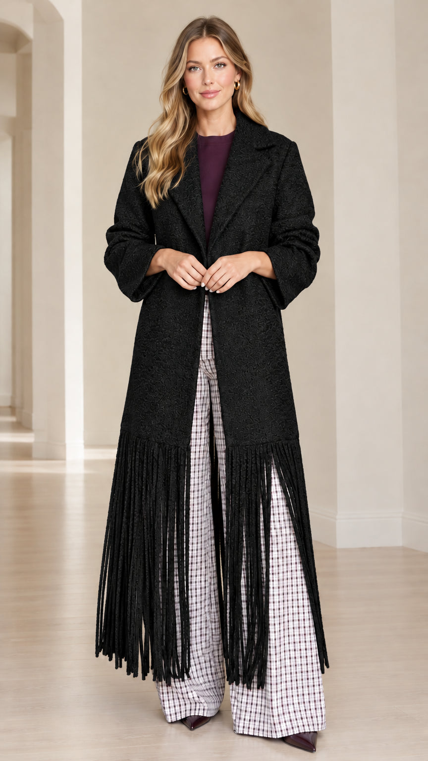 Model wearing Black textured bouclé fringe hem longline overcoat